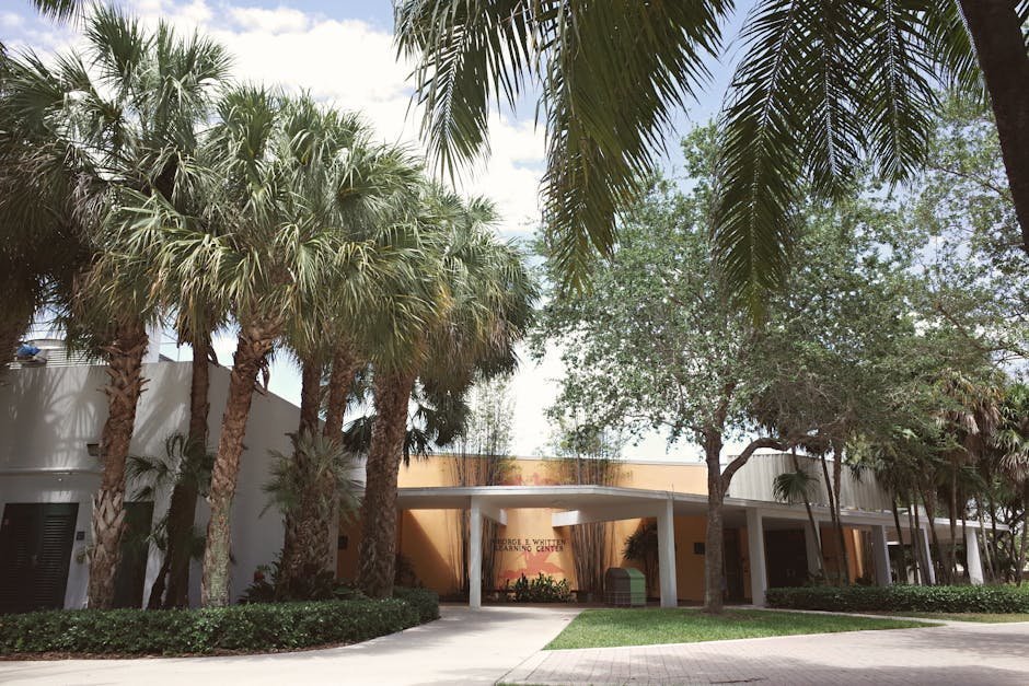 University counseling center entrance with after-hours crisis signage and student resources board