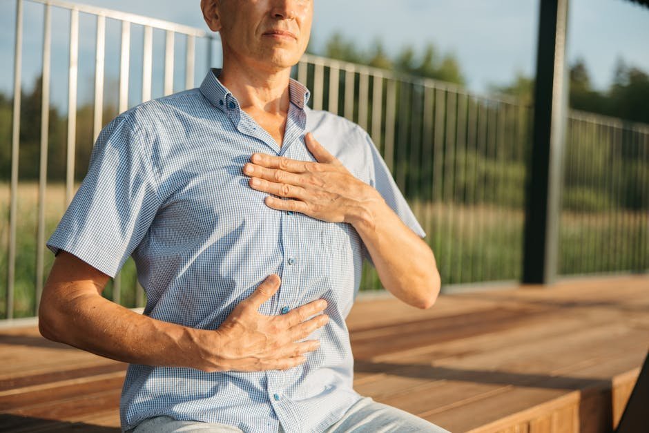 Person breathing rapidly with hands cramped and curled in characteristic tetany position