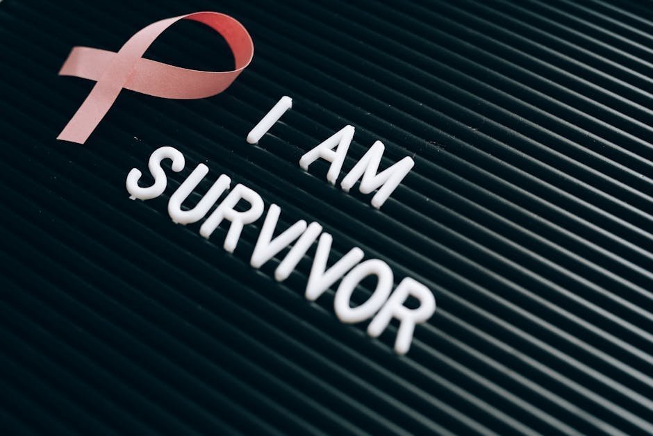 Survivor and advocate sitting together in a quiet rape crisis center waiting area with soft lighting and tissues on the table