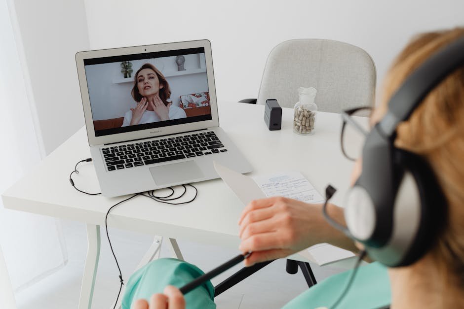Patient in telemedicine appointment with clinician on laptop screen in a home setting, conveying remote MAT access