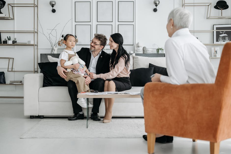 Family meeting with social worker and psychiatrist in a hospital conference room