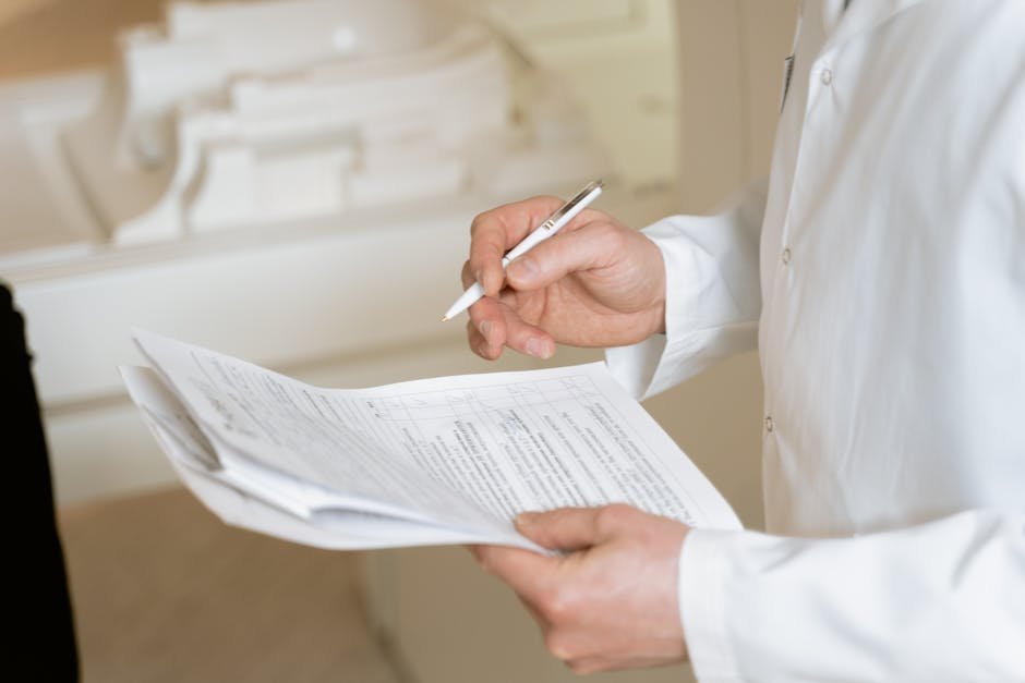 Pharmacist and physician reviewing antipsychotic restart plan after NMS recovery