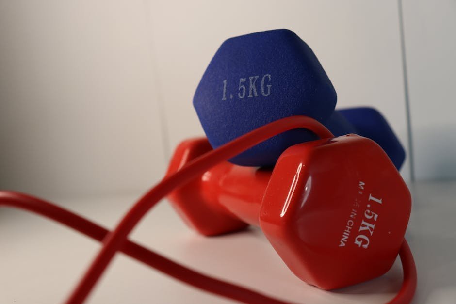 Resistance training with dumbbells in a home gym setting