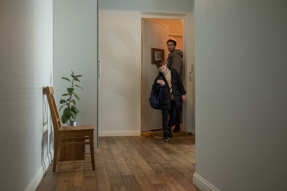 Father pausing in hallway to regulate before returning to upset toddler