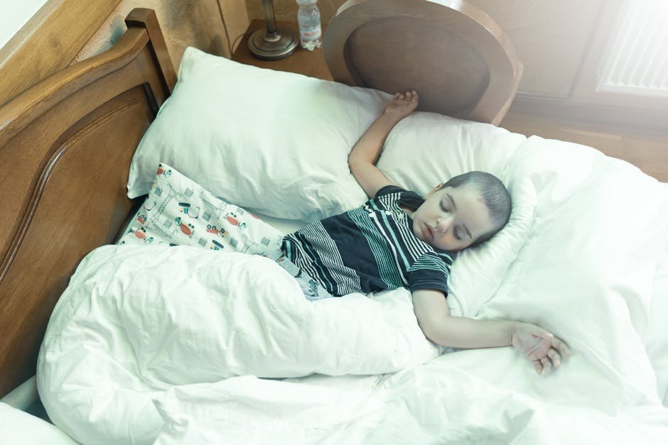 Child wearing home sleep study sensors sleeping peacefully
