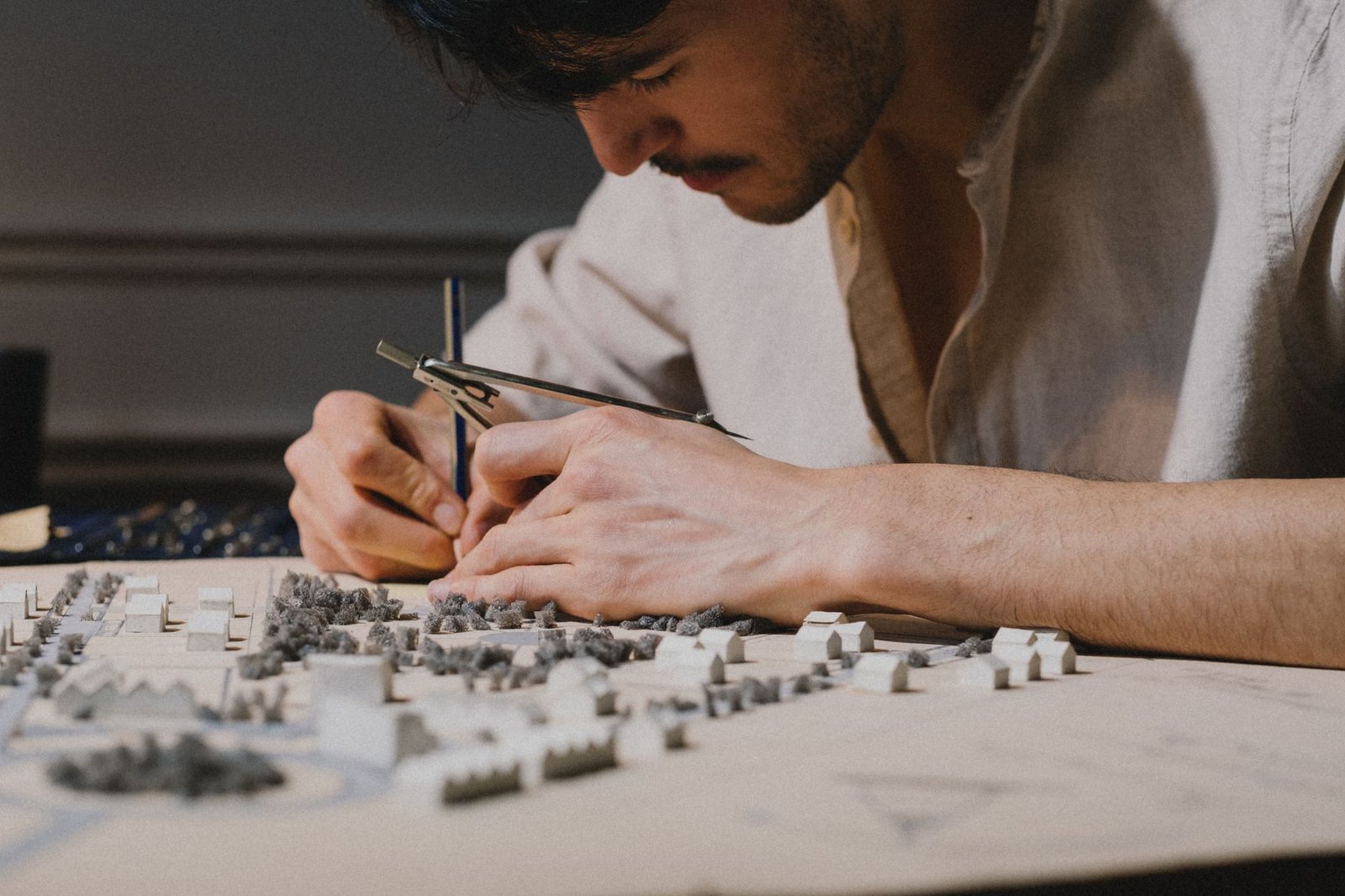 Architecture student building a scale model in a design studio
